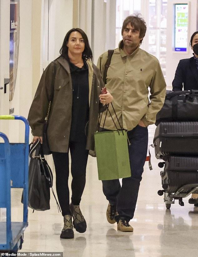 Liam Gallagher's fiancée Debbie Gwyther, 39, flashed her engagement ring at Sydney airport on Friday