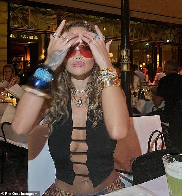 Sizzling: Rita delighted fans with a photo dump on Monday as she shared sultry snaps from her recent getaway in Paris, with a noticeable new addition on her wedding finger