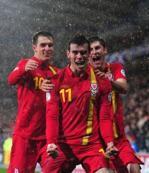 Bale was now the talisman of the Wales team. Here he celebrates one of his two goals against Scotland in Cardiff in 2014.