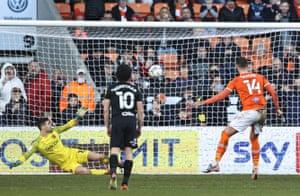 Gary Madine of Blackpool spanks the ball down the middle to put his side ahead against Hull City.