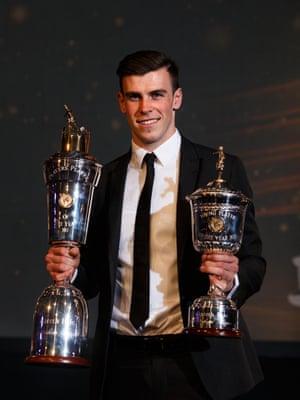 Bale with his PFA Player of the Year Award and his PFA Young Player of the Year Award in 2013. He also won the Football Writers’ award, one of only two players ever to do so.