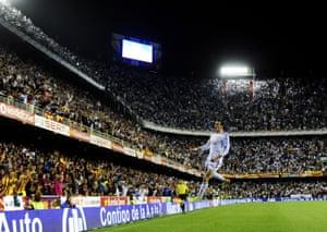 Bale leaping for joy after scoring during the Copa del Rey final against Barcelona at Mestalla in Valencia in April 2014.
