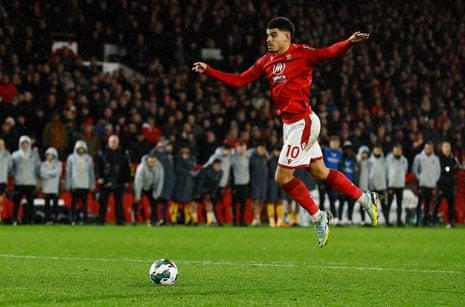 Nottingham Forest's Morgan Gibbs-White scores a penalty during the penalty shoot-out.