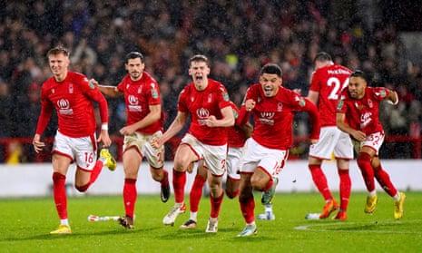 Nottingham Forest players celebrate after winning the penalty shoot-out in their Carabao Cup quarter-final against Wolverhampton Wanderers.