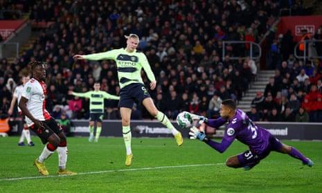 A header by Manchester City's Erling Haaland is grabbed by Southampton's keeper Gavin Bazunu.