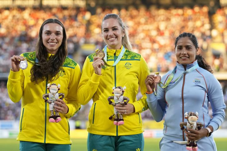 Medallists in the women's javelin at the Commonwealth Games hold up their medals.