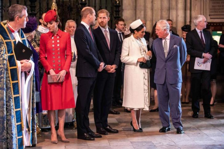 Meghan Markle speaks to King Charles as Prince William speaks with Prince Harry and Kate Middleton speaks to Queen Camilla.